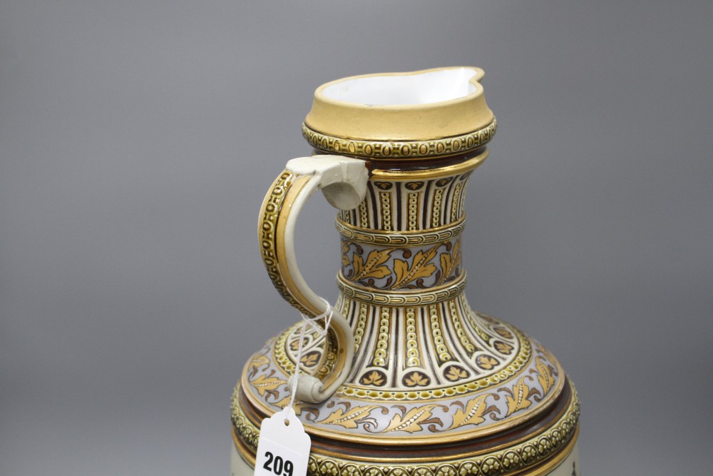 A large Villeroy and Boch Mettlach ewer, decorated with figures drinking, dancing and musicians, impressed 1159, height 45cm